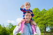 Foto: Father and daughter on a summer meadow Father and daughter on a summer meadow