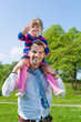Foto: Father and daughter on a summer meadow Father and daughter on a summer meadow
