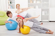 Photo: Kids exercising with their mother Kids exercising with their mother