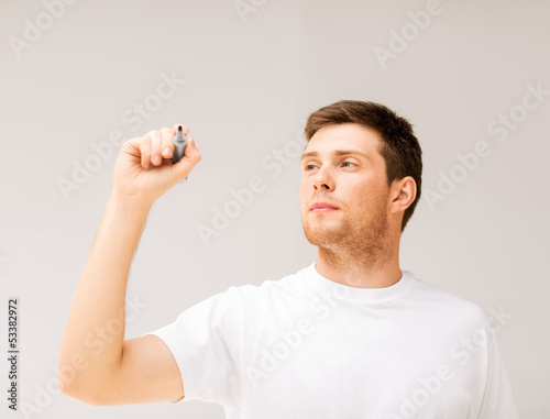 Photo: man writing something in the air man writing something in the air