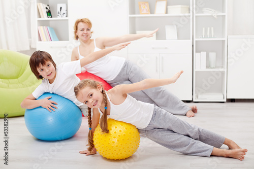 Photo: Kids exercising with their mother Kids exercising with their mother
