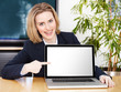 Business woman presenting her laptop with copyspace