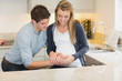 Man touching partners pregnant belly