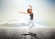 Photo: Woman jumping over wooden boards Woman jumping over wooden boards