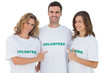 Group of volunteers pointing their tshirt