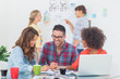 Photo: Cheerful designers brainstorming together Cheerful designers brainstorming together