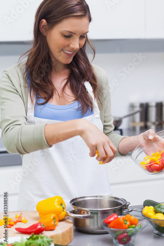 Photo: Pretty woman cooking Pretty woman cooking