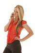 Woman in red top serious on phone
