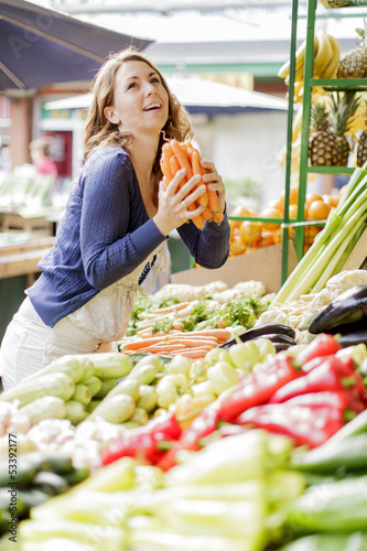 Photo: Young woman at the market Young woman at the market