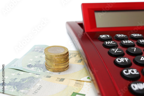Photo: savings concept with money and calculator savings concept with money and calculator