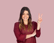 Attractive girl making the victory symbol