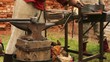 Video: Smith makes a metal object on the historic festival Smith makes a metal object on the historic festival