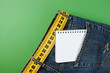 jeans with meter belt slimming and notebook in pocket on the gre