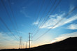 Power transmission towers at sunset