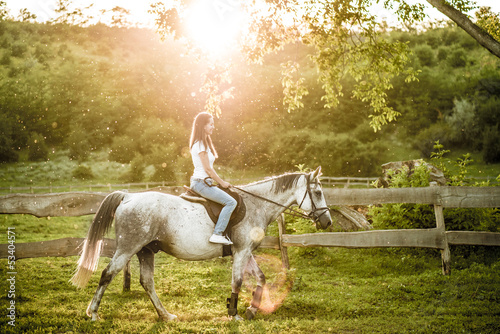 Photo: Woman getting ready for horseback riding Woman getting ready for horseback riding