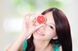 Photo: woman holding grapefruit cover her eyes woman holding grapefruit cover her eyes