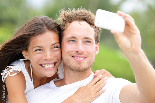 Photo: Couple fun taking self-portrait picture photos Couple fun taking self-portrait picture photos