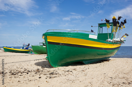 Photo: colorful fisher boats on Baltic beach colorful fisher boats on Baltic beach