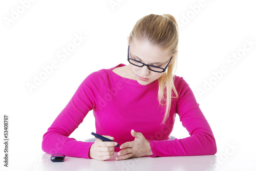 Photo: Diabetes patient measuring glucose level blood test using ultra Diabetes patient measuring glucose level blood test using ultra