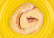 Honey bun on yellow plate