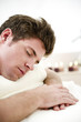 Young man relaxing in health spa