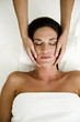 Young woman getting a facial massage