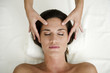 Young woman getting a facial massage