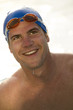 Young man in health club swimming pool
