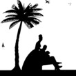 Wedding couple on the beach under the palm tree silhouette