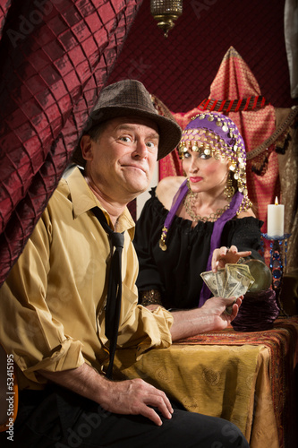 Photo: Fortune Teller Getting Paid Fortune Teller Getting Paid