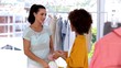 Woman looking at the purchases of a friend