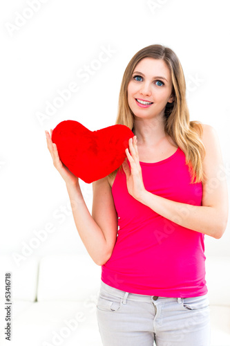 Photo: woman holding a red heart woman holding a red heart
