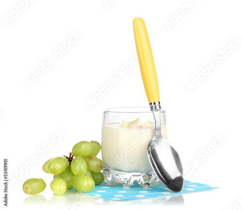 Photo: Delicious yogurt in glass with grapes isolated on white Delicious yogurt in glass with grapes isolated on white