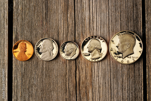 Photo: US cent coins over wooden background US cent coins over wooden background