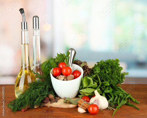 Photo: Composition of mortar, bottles with olive oil and vinegar, and Composition of mortar, bottles with olive oil and vinegar, and