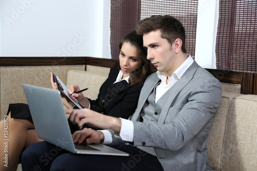 Photo: Business people on sofa Business people on sofa