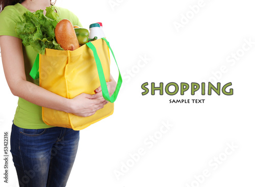 Photo: Girl with shopping bag isolated on white Girl with shopping bag isolated on white