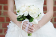 Bride holding wedding flowers bouquet