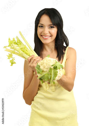 Photo: Girl with fresh celery and cauliflower isolated on white Girl with fresh celery and cauliflower isolated on white