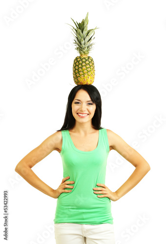 Photo: Girl with fresh pineapple isolated on white Girl with fresh pineapple isolated on white