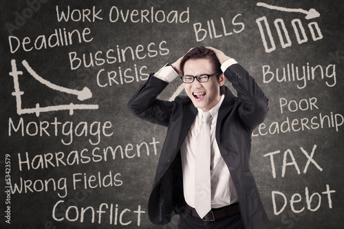 Photo: Angry businessman shouting in class Angry businessman shouting in class
