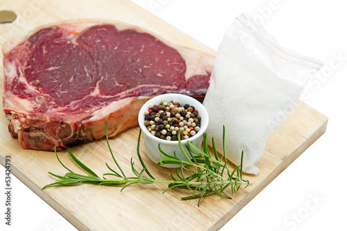 Photo: Raw dry aged t-bone steak Raw dry aged t-bone steak