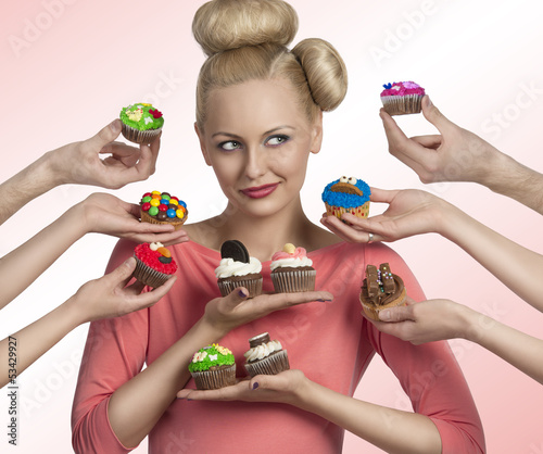 Photo: girl and some hands with cupcakes girl and some hands with cupcakes