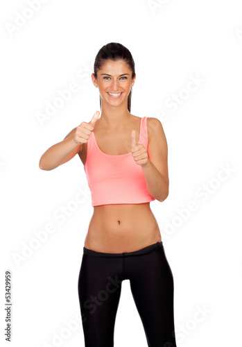Photo: Attractive girl with sports clothes saying Ok Attractive girl with sports clothes saying Ok
