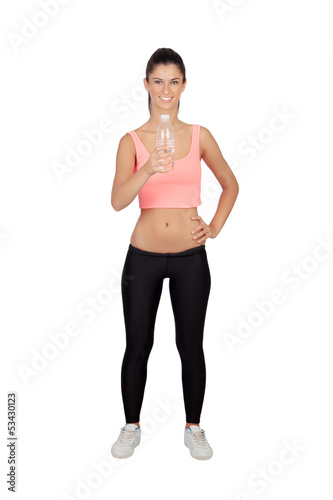 Photo: Attractive brunette girl drinking water during training Attractive brunette girl drinking water during training