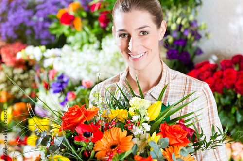 Photo: Female florist in flower shop Female florist in flower shop
