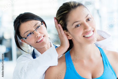 Photo: Gym doctor checking on a patient Gym doctor checking on a patient
