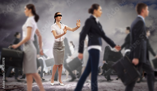 Photo: Businesswoman in blindfold among group of people Businesswoman in blindfold among group of people