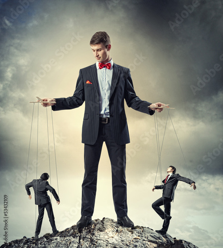 Photo: Businessman puppeteer Businessman puppeteer
