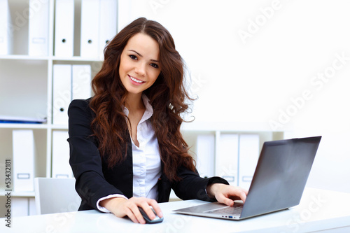 Photo: Young busines woman with notebook Young busines woman with notebook